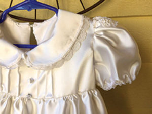 A christening dress sewn by Sandi Barrett