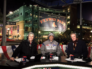 Tom Caron sits with broadcasters and retired baseball stars Jim Rice, and Steve Lyons.