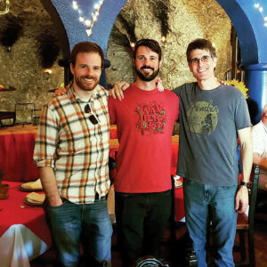 Phil Knutel (right) stands with his two biological brothers who he reconnected with after meeting his birth mother, Maggie. 