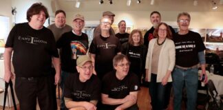 Chris Johnson (front right) celebrated the first live event at the Zullo Art Gallery in Medfield with a group of DJs and the band “The Cast Irons” after the show.