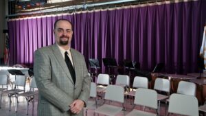 Dedham high school drama and music teacher Steven Bergman brings his professional theater experience to his students.