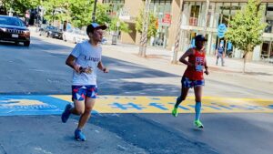 Connie Cao and son Enchee Xu cross the finish line of the 2020 Boston Marathon, which was a virtual race due to the pandemic.