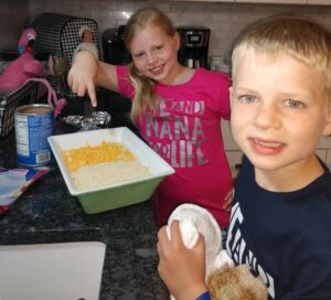 Kailyn and Ryan Croeber make homemade macaroni and cheese on their first day of "Nana Camp."