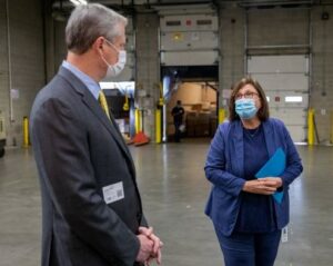 Gov. Charlie Baker meets with Catherine D'Amato at Greater Boston Food Bank.