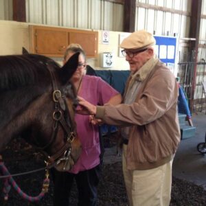 At an equine therapy program at Windrush Farm, people with dementia are introduced to a horse and develop a bond.