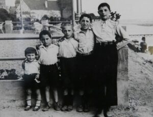  Israel Arbeiter, center, with his brothers in Poland before World War II. Photo/Submitted