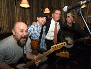 Appearing at a 2017 community event at Banyan Bar + Refuge in Boston are then-Mayor Marty Walsh (second from right) with Comanchero bandmates (l to r) Bob Moon, Sam Margolis and Greg Moon.