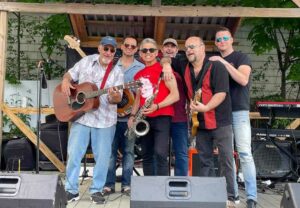 Posing onstage at Worcester MCL during a 2021 gig are Nasty Habits bandmates (l to r) Deke Kenderian, Chris Houston, Mike Sanpietro, Jody Ryan, Bob Moon and Jay Whitehurst.