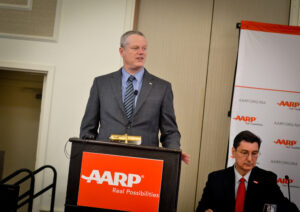 Governor Charlie Baker presents the blueprint recommendations of his Council to Address Aging in Massachusetts to AARP Massachuestts Director Mike Festa (right) on April 11, 2018, and announces joining the AARP Network of Age-Friendly States and Communities. Photo/Lucyus Fevrier/CC BY-NC-SA 4.0