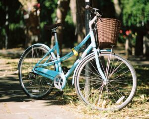 Janice Lindsay reminisces about her first bike that she shared with her little sister and how she used to tell her, "Keep Pedaling!" (Blue bicycle photo by Jim Killock)