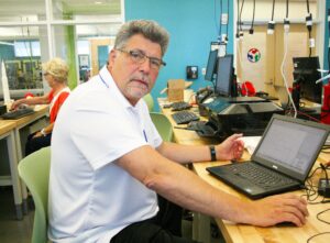 Mike Meagher, an adjunct faculty member in QCC’s Electronics Engineering Technology program, works in the college’s Fab Lab. 