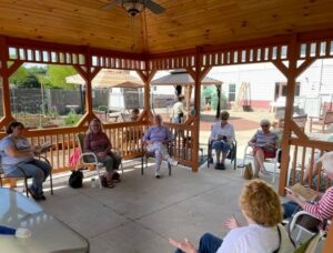 The Milford library’s book club met outside in the gazebo at the town’s senior center during the warm weather. Photo/Submitted