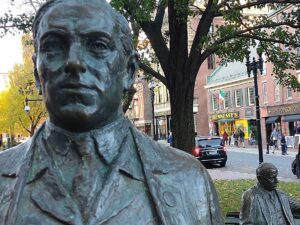 The statue of legendary politician James Michael Curley, the four-term mayor of Boston, is located right across the street from Boston City Hall. Photo/IrishHeritageTrail.com