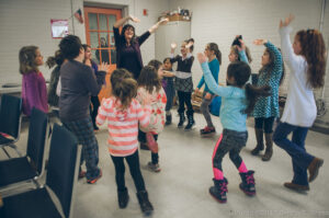 Lelia Tenreyro-Viana loves teaching voice, rhythm, and movement to her members of the Charles River Children’s Chorale in Millis. Photo/Sergio R. Reyes