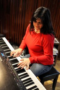 As Director of Music Ministry for St. Cecilia’s Church in Ashland, Lelia Tenreyro-Viana plays during worship services, sings at funerals and memorial services, and directs the teen and adult choirs. Photo/Deborah Burke Henderson