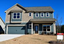 Replacing an old and worn-out garage door is one simple home improvement to boost a home’s curb appeal.
