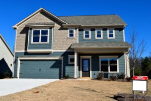 Replacing an old and worn-out garage door is one simple home improvement to boost a home’s curb appeal.