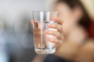 Drinking two liters of water, about eight glasses containing eight ounces each, the so-called eight-times-eight rule, is a good daily target for proper hydration.