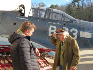 Robert Collings, left, president of the Collings Foundation, shows Russell Phipps, who served in the Army Air Corps during World War II, a SBD Dauntless aircraft recently pulled out of Lake Michigan. The plane will become part of the American Heritage Museum’s Pacific Theater exhibit.