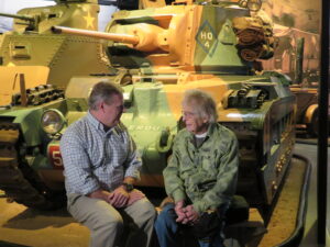 Hunter Cheney, left, director of marketing and communication for the American Heritage Museum in Hudson, chats with Russell Phipps, who served with the Army Air Corps during World War II. Phipps turned 101 on Dec. 28.
