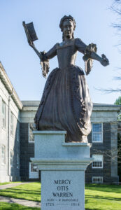 A statue of Mercy Otis Warren stands outside the Barnstable County courthouse.