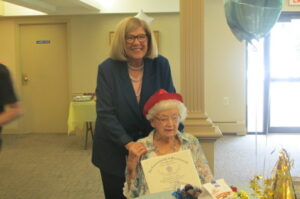 Hudson resident Esther Folkes poses with State Rep. Kate Hogan at her 104th birthday celebration on May 5 at Peter’s Grove in Hudson. 