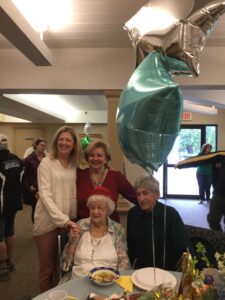 Esther Folkes celebrates her birthday with granddaughters Debbie DeGregorio and Maria Folkes and son Donald Folkes. 