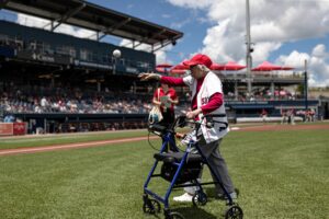 Alberta Fullem throws the opening pitch at the WooSox’s June 25 game against the Lehigh Valley IronPigs.