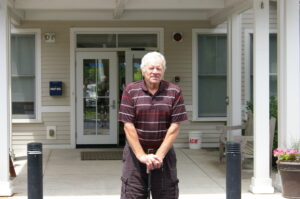 Ken Bennett stands in front of the Northborough Senior Center. Bennett leads weekly hikes throughout town. Photo/Tyler Charpentier

