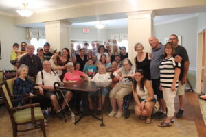  Mildred Wheeler (seated center) is surrounded by family for her 106th birthday celebration in August at Whitney Place at Northborough. 