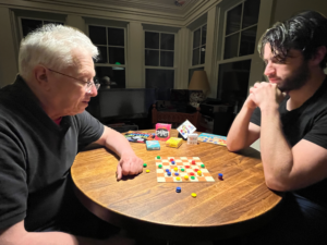 Gene Mackles and his son Matt play his game Schmeckers, which Matt co-created, together.Photo/Submitted