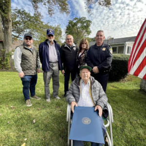 Charles “Charlie” Audet of Framingham, front, with city officials, was honored recently on his 105th birthday by the city where he has lived for over 60 years.Photo/Courtesy of the City of Framingham
