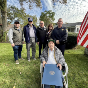 Charles “Charlie” Audet of Framingham, front, with city officials, was honored recently on his 105th birthday by the city where he has lived for over 60 years.Photo/Courtesy of the City of Framingham