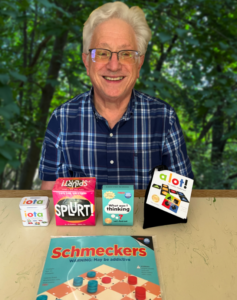 Gene Mackles with some of the games he has designed.Photo/Submitted