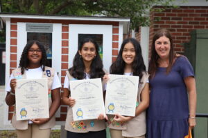 The three members of Girl Scout Troop 11087 are presented with citations by Rep. Hannah Kane. (Photo/Evan Walsh)