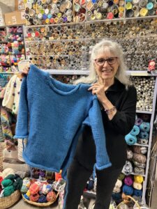 Lisa Lazdowsky’s store hosts, teaches, and supplies area students who knit and craft items to donate to and raise funds for the homeless.Photo/Matt Robinson
