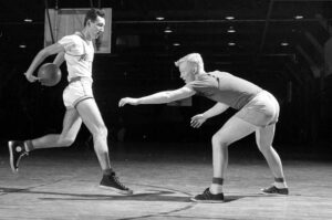 Basketball player turned salesman Chuck Taylor, left, is the namesake for the iconic Converse sneaker.Photo/Wikimedia Commons 