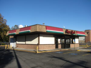 The Bedford Papa Gino’s location features its classic look with the colors of the Italian flag prominently displayed on the façade.
