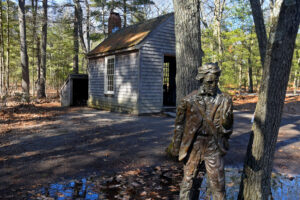 A statue of Thoreau and a replica of the single-room cabin that he built during his stay at Walden Pond is situated near the visitors center.