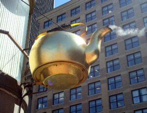 Boston’s iconic steaming kettle, now 150 years old, graces the façade of a Starbucks coffee shop in Government Center.