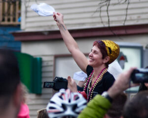 Johnny D’s owner Carla DeLellis waves in appreciation at the parade by local musicians when the Somerville nightclub closed on March 13, 2016.Photo/Tom Hazeltine

