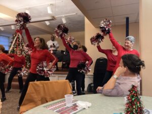 The Wakefield Pomtastics squad performing at the senior center holiday party.