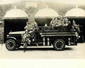  Northborough firefighters sit on the Maxim engine in this photo from the 1920s. (Photo/Courtesy Northborough Firefighters Association). 