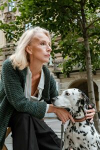 Woman and Dalmatian dog, symbolizing pet loss grief support in Westborough, MA.