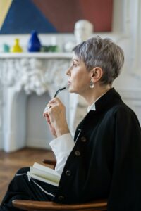 Mature woman thoughtfully considering retirement financial planning.