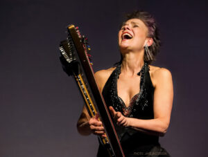 Deborah Henson-Conant, Grammy-nominated harpist and composer, performing with her harp.