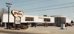 Palace nightclub exterior in Saugus, featuring iconic sign and multi-room structure, significant venue from 1982 to 2006, known for housing multiple clubs.