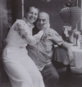 Sally and Nathan Birke, owners of Birke’s Department Store in Lowell, posing together in a warm, intimate moment, reflecting their partnership and the store's welcoming atmosphere.