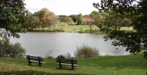 Green Hill Park in Worcester, Massachusetts, featuring a pond, benches, and recreational area