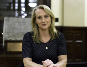 Piper Kerman at a book signing event, promoting her memoir "Orange Is the New Black," reflecting on her experiences in federal prison and advocating for criminal justice reform.